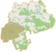Mapa konturowa powiatu drawskiego, u góry znajduje się owalna plamka nieco zaostrzona i wystająca na lewo w swoim dolnym rogu z opisem „Siecino”