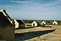 Image 19The forced African migrants brought to the Caribbean lived in inhumane conditions. Above are examples of slave huts in Dutch Bonaire. About 5 feet tall and 6 feet wide, between 2 and 3 slaves slept in these after working in nearby salt mines. (from History of the Caribbean)