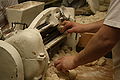 4/12 Inserting dough, machine rolls kifli automatically
