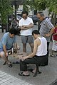 中国象棋；摄于北京望京新城。People playing Chinese Chess in Wangjing Xincheng, Beijing.