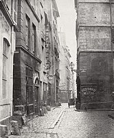 The Rue des Marmousets, one of the narrow and dark medieval streets on the Île de la Cité, in the 1850s. The site is near the Hôtel-Dieu (General Hospital on the Île de la Cité).