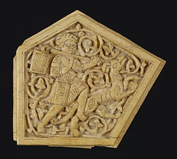Home corrent amb el seu gos molt realista, probablement part de la incrustació decorativa d'una peça de mobiliari d'Egipte durant l'època fatimita (909-1171).
