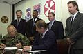 Image 49National Federation of Federal Employees officials sign a collective bargaining agreement with the U.S. 8th Army in October 2002.