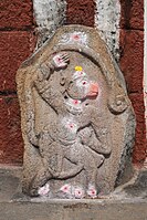 Relief of Hanuman in the court of the Uddana Veerabhadra Temple. The colour blots on the relief are made by priests or devotees with sindoor.