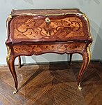 Rococo slant-top desk; c.1750; oak, kingwood marquetry, amaranth wood, satiné, gilt bronze; unknown dimensions; Musée des Arts Décoratifs (Paris)[60]