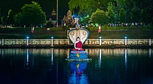 A statue of Mucalinda protecting the Buddha in Mucalinda Lake, Mahabodhi Temple