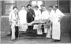 Dr. A.T. Still and students examine a cadaver as part of a human anatomy class.