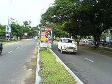 Four-lane road, with narrow grass median
