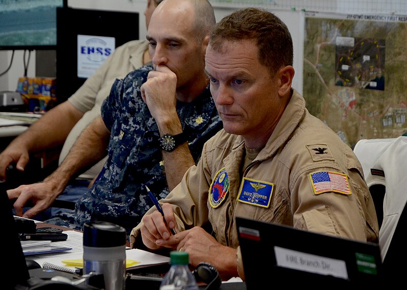 File:Capt. David Culpepper listens to a brief regarding Hurricane Matthew in the emergency operations center (30108639181).jpg