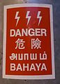An electrical hazard sign in Malaysia written in Tamil with other languages