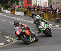 2013 Isle of Man TT Saturday afternoon practice — Bruce Anstey (5), James Hillier (1) & Gary Johnson (7); Parliament Square, Ramsey 1 June 2013.