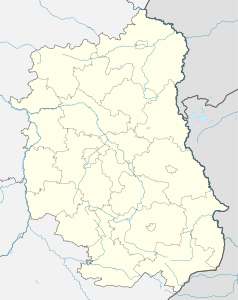 Mapa konturowa województwa lubelskiego, u góry nieco na lewo znajduje się punkt z opisem „Osiedle Bronisława Chącińskiego”