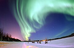 First place: The Aurora Borealis, or Northern Lights, shines above Bear Lake, Eielson Air Force Base, Alaska Joshua Strang (Public domain)