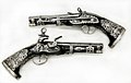 Pair of Miquelet Pistols, in the Peninsular Spanish style, made in colonial Mexico, dated 1757, at the Metropolitan Museum of Art[16]