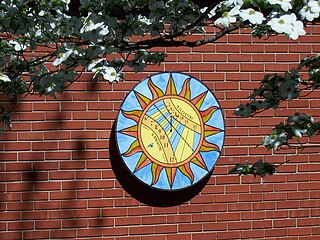 Porcelain and stained glass sundial wall sconse in Kansas City KS