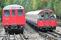 London's underground trains come in two different sizes - the smaller 'tube' trains and the larger 'mainline' size trains. A Metropolitan Line 'A' stock subsurface train and a Piccadilly Line 1973 tube train.