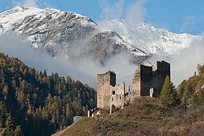 Tschanüff castle, in the background parts of the Piz Spadla mountain, in Switzerland.