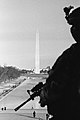 Image 11Photograph of a National Guardsman looking over the Washington Monument in Washington D.C., on January 21, 2021, the day after the inauguration of Joe Biden as the 46th president of the United States (from Photojournalism)