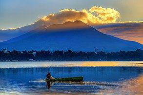 A morning scene at Sampaloc Lake in San Pablo, Laguna with a beautiful ray of light pointing Mount Banahaw. Photograph: Klienneeco