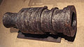 200 kg wrought iron bombard, circa 1450, Metz, present-day France. It was manufactured by forging together iron bars, held in place by iron rings. It fired 6 kg stone balls. Length: 82 cm.