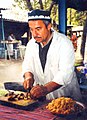 Image 4A man makes plov, the national dish of Tajikistan. (from Culture of Tajikistan)