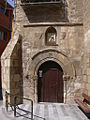 Uno de los dos portales románicos de la iglesia de san Pedro. Entrada a la sacristía.→