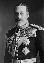 Pale-eyed grey-bearded man of slim build wearing a dress uniform and medals