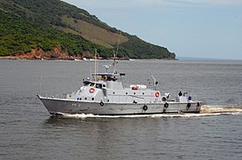 US Navy 100618-N-4971L-003 A patrol boat escorts High Speed Vessel Swift (HSV 2) as it arrives for a port visit.jpg