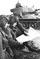 Image 42Soldiers in an East German tank unit reading about the erection of the Berlin Wall in 1961 in Neues Deutschland (from Newspaper)