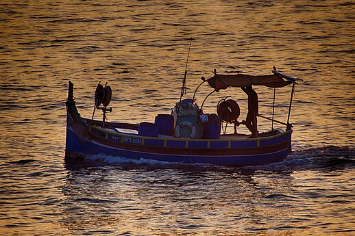 Maltese tradiational colourful fishing boat at daybreak Photographer: Christian Formosa