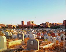 a muslim cemetery at sunset.