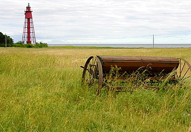 Lighthouse and abandoned farming equipment at Kapelludden