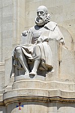Stone sculpture of Miguel de Cervantes (1547–1616) by Lorenzo Coullaut Valera (1876–1932). Detail of the monument to Cervantes (1925–30) at the Plaza de España in Madrid (Spain).