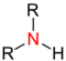 Atom azotu z przyłączonymi dwiema grupa funkcyjnymi (R) i jednym atomem wodoru
