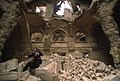 Vedran Smailović playing the cello in the ruins of the National Library (Vijećnica) after it was burnt down during the Siege of Sarajevo, 1992.
