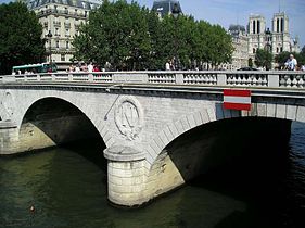 Haussmann reconstructed The Pont Saint-Michel connecting the Île-de-la-Cité to the left bank. It still bears the initial N of Napoléon III.
