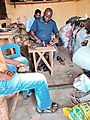 A Cobbler making a sandals in Northern Ghana