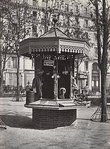 A kiosk for a street merchant on Square des Arts et Metiers (1865).