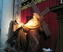 Padre Pio che aiuta Cristo a portare la croce nella chiesa di San Salvatore in Lauro a Roma.