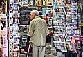 "An_old_man_in_newsagent's_shop,_Paris_September_2011.jpg" by User:M2545
