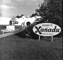 A photo of a welcome sign and entry path for the Xanadu house in Kissimmee, Florida.
