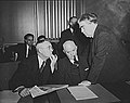Image 46John L. Lewis (right, President of the United Mine Workers, confers with Thomas Kennedy (left), UMW Secretary-Treasurer of the UMW, and a UMW official at the War Labor Board in 1943 about a coal miners' strike.