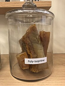 Photo of pieces of polyisoprene in a jar.