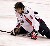 Hockey player stretching groin