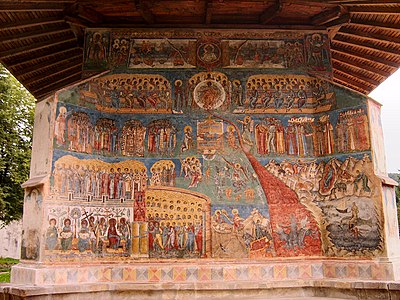 Le Jugement dernier, fresque du monastère Voroneţ en Roumanie. En haut, l'image du Christ est entourée, à droite et à gauche, par les signes du zodiaque.