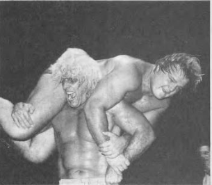 File:Ric Flair performing an airplane spin on Greg Valentine, 1980.png