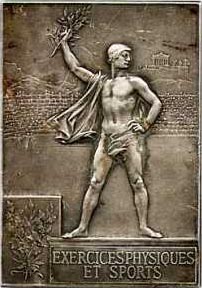 Médaille rectangulaire représentant un athlète sur un podium brandissant une branche de laurier avec à l'arrière-plan l'acropole d'Athènes
