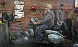 Bant Singh, 62, a Bajaj Scooter mechanic for the last 40 years poses for a photograph
