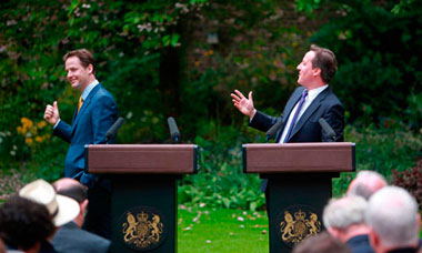 David Cameron and Nick Clegg hold a press conference in the garden of 10 Downing Street.