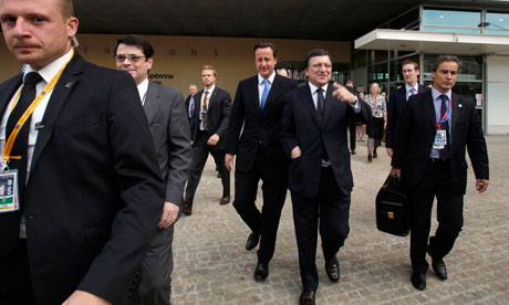 David Cameron walks to an EU summit